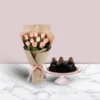 Ferrero Rocher Truffle Cake with Pink Roses, featuring luxurious chocolate truffles and elegant pink roses, ideal for a sophisticated celebration.