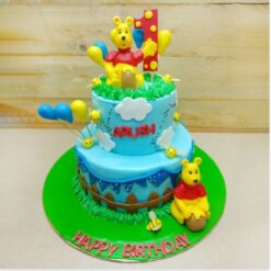 Charming Winnie the Pooh cake with playful decorations and delightful details, ideal for birthdays and special occasions, showcasing the latest Pooh-themed cake designs.