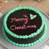 Merry Christmas Chocolate Cake with rich chocolate flavor and festive decorations, ideal for adding a touch of indulgence to holiday celebrations.