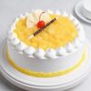 Creamy Pineapple Dream Cake featuring fluffy layers infused with pineapple flavor, topped with creamy frosting and garnished with fresh pineapple slices.