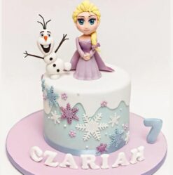 Frozen themed cake with icy blue hues and snowflake decorations, perfect for winter celebrations and Frozen fans.