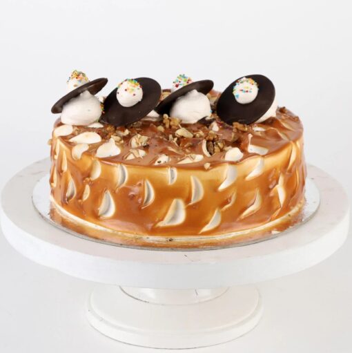 Golden Walnut Caramel Bliss cake showcasing rich caramel layers and crunchy walnut topping, ideal for dessert lovers and special celebrations.