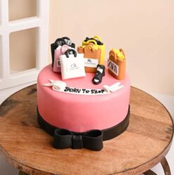 Shopaholics Fondant Cake decorated with stylish shopping-themed elements, perfect for celebrating birthdays or special occasions for fashion lovers.