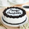 Frosted Black Forest Christmas Cake with rich layers of chocolate, cherries, and festive frosting, perfect for holiday celebrations.