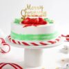 Frosted Christmas Wreath Cake with intricate decorations and a festive wreath design, perfect for adding holiday charm to your celebrations.