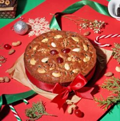 Christmas Fruit & Nut Cake decorated with festive toppings.