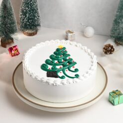 Jolly Christmas Tree Cake with festive decorations, shaped like a Christmas tree, ideal for holiday gatherings and festive treats.