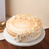 Butterscotch Bliss New Year Cake with smooth butterscotch layers and festive decorations, perfect for ringing in the New Year with deliciousness.