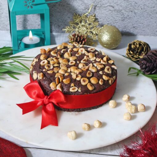 Christmasy Nutty Cake with festive decorations, packed with crunchy nuts, ideal for holiday gatherings and Christmas desserts.