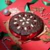 Plum Christmas Bliss Cake with festive decorations, rich in plums and spices, ideal for holiday desserts and Christmas treats.