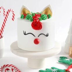 Rudolph Christmas Charm Cake with a playful Rudolph the reindeer design, adding a fun and festive touch to your Christmas celebrations.