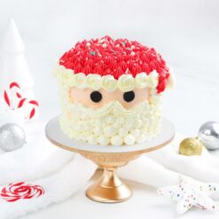 Creamy Claus Christmas Cake featuring a festive Santa design and smooth creamy texture, ideal for spreading holiday joy and cheer.