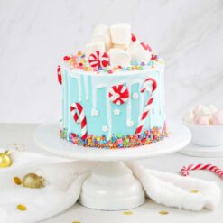 Snowfall Christmas Delight Cake with snowy decorations and a winter wonderland design, ideal for bringing festive cheer to holiday gatherings.