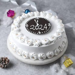 Vanilla New Year Cake decorated with festive accents, a light and fluffy cake to celebrate the arrival of the New Year.