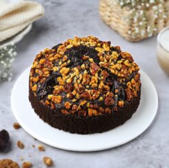 Golden Walnut Date Cake with a rich combination of sweet dates and crunchy walnuts, creating a perfect dessert for any occasion.