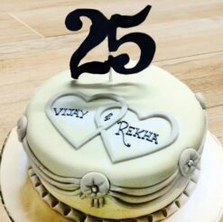 Silver Jubilee Anniversary Cake adorned with elegant silver accents and celebratory decorations, marking 25 years of love and togetherness.