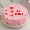 Be Mine Strawberry Cake with vibrant pink frosting, fresh strawberries, and a heart-shaped design, crafted for love-filled moments.