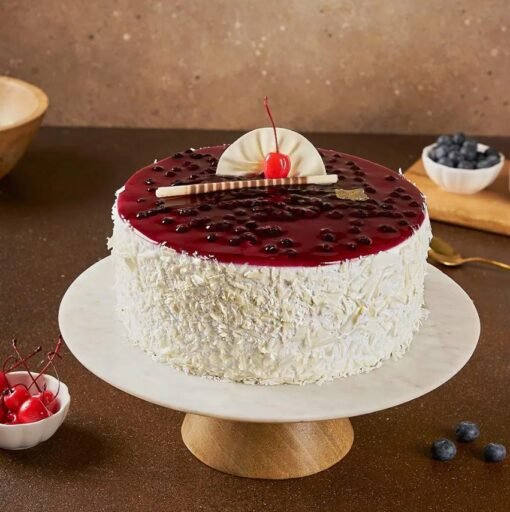 White Forest Blueberry Cake with creamy layers, white chocolate, and fresh blueberries, offering a perfect blend of flavors for every celebration.