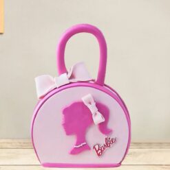 Chic Barbie Bag Cake featuring a fashionable handbag design in pink tones, perfect for Barbie-themed birthdays or special occasions.