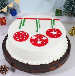 Christmas Charm Ornament Cake with intricate festive designs, resembling ornaments, and rich holiday-inspired flavors.