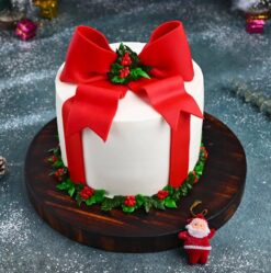 Christmas Present Cake designed to resemble a wrapped gift box with festive decorations, perfect for holiday celebrations and gifting.