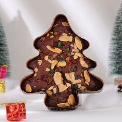 A delicious Christmas Tree Plum Cake, decorated with a festive Christmas tree design.