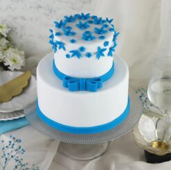 Elegant Blue Bow Tier Cake with luxurious blue bows and refined tiered design, perfect for weddings, anniversaries, or sophisticated events.