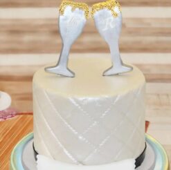 Elegant Champagne Fondant Cake featuring delicate fondant work and a sophisticated champagne color.