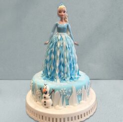 Elsa's Magic Frozen Cake with icy decorations, snowflakes, and Elsa topper, perfect for Frozen-themed events and birthdays.