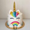 Enchanted Unicorn Cake featuring a pastel rainbow mane, golden horn, and delicate details, ideal for magical birthday celebrations.