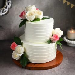 Petal Perfection Wedding Cake with intricate petal designs, soft pastel tones, and decadent flavors, ideal for elegant wedding celebrations.