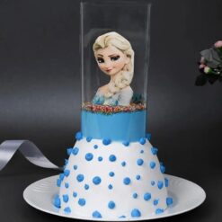 Frozen-themed pull-up cake with cascading frosty blue and white layers.