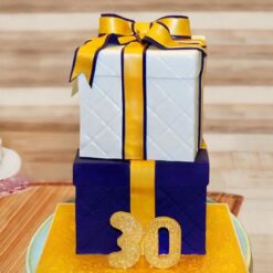 Gift Box Tier Cake featuring intricate designs, elegant layers, and a unique gift box presentation for special occasions.