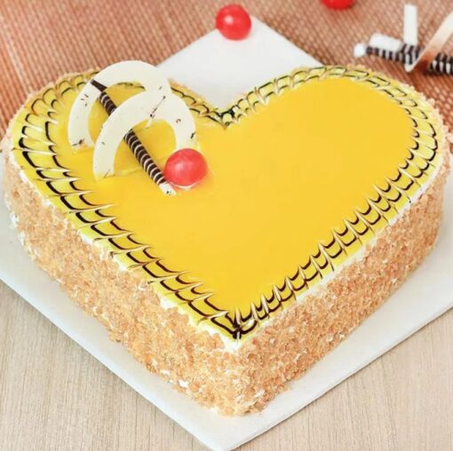 Golden Heart Butterscotch Cake with intricate decorations.