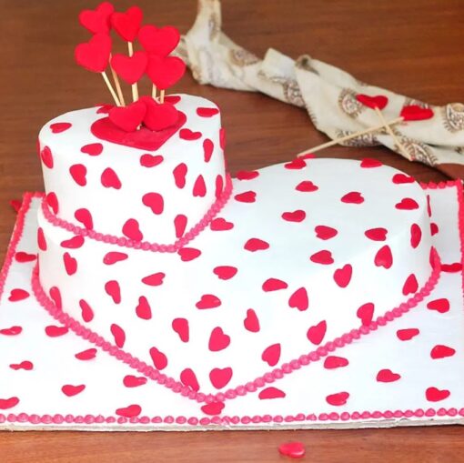 Heart Shaped Tier Cake with multiple layers, smooth frosting, and intricate romantic decorations, perfect for celebrations of love.