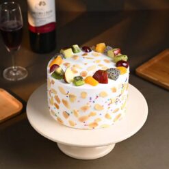 Island Love Fruit Cake featuring a blend of tropical fruits such as mango, pineapple, and coconut on a moist cake base.