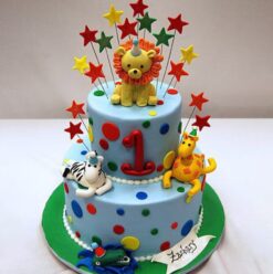 A beautifully designed Jungle Safari Tier Cake featuring animal-themed decorations and vibrant colors.