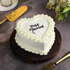 Just Married Cake featuring elegant decorations and a touch of romance.