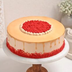 Luscious Red Velvet Coffee Cake blending rich coffee essence with moist red velvet layers, topped with creamy frosting and artistic designs.