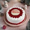 Merry Velvet Christmas Cake with a festive red and white design, velvety texture, and delightful holiday flavors.