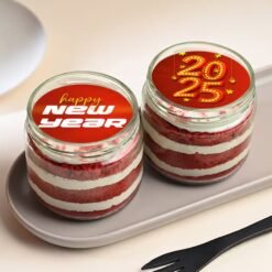 New Year Red Velvet Jar Cake Duo – two red velvet jar cakes layered with cream, ideal for festive New Year indulgence and sharing.