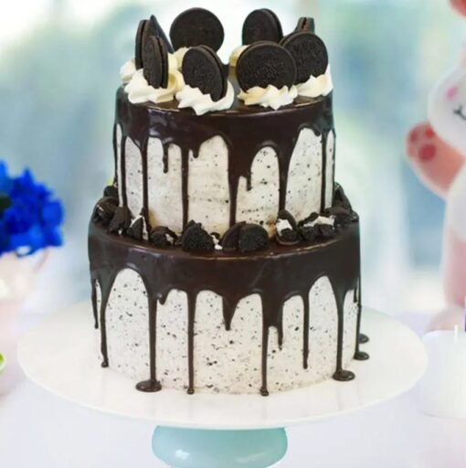 Oreo Tiered Cake with creamy layers, chocolate cake, and Oreo cookie decorations.