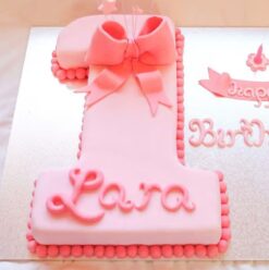 A beautifully crafted Pink Number One Cake, perfect for first birthday celebrations with a touch of charm.