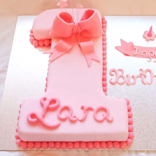 A beautifully crafted Pink Number One Cake, perfect for first birthday celebrations with a touch of charm.