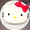 Charming Hello Kitty Cake featuring a delightful design with a cute kitty face, vibrant frosting, and playful decorations.