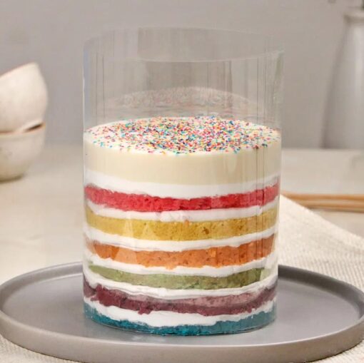 Rainbow Joy Pull-Up Cake with colorful layers and a pull-up design, revealing a surprise treat for an exciting celebration.