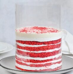 Red Velvety Pull Up Cake with rich layers and cascading frosting effect for a dramatic dessert experience.