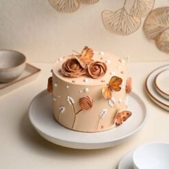 Roseate Butterfly Cake with soft pink hues, delicate rose petals, and intricate butterfly designs, perfect for elegant celebrations.