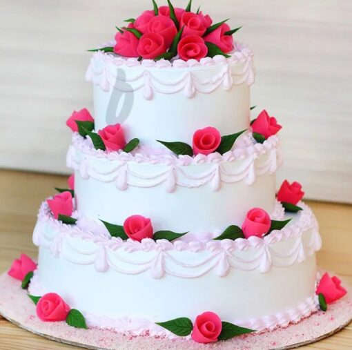 Rose Vanilla Wedding Cake featuring soft vanilla layers and beautiful rose accents.