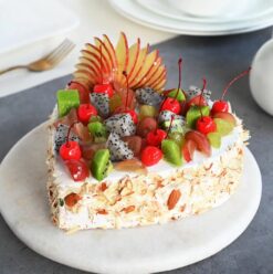 Fruitful Heart Delight Cake featuring an array of fresh, vibrant fruits arranged in a heart shape for a sweet, celebratory treat.